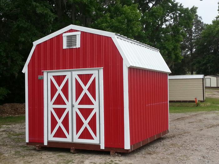 Red aluminum high-loft lofted barn with white trim and gable vent
