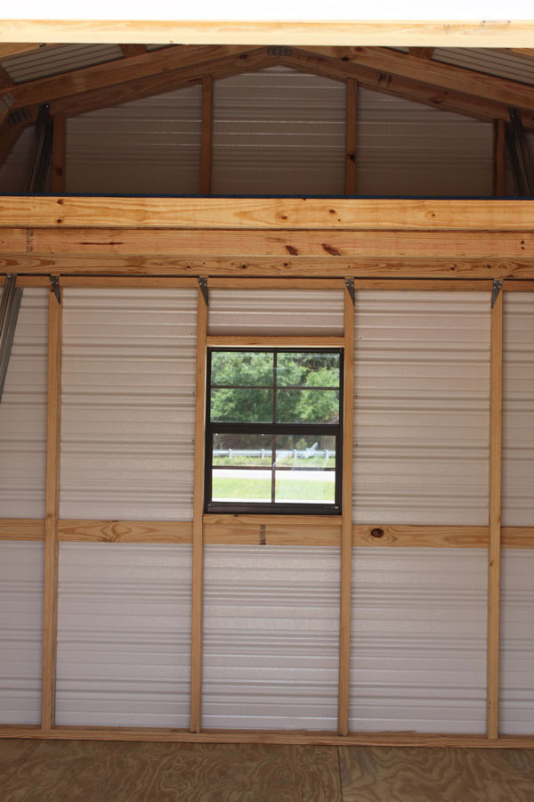 Interior of a barn-style high-loft aluminum shed